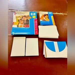 Big group of hp photo paper.